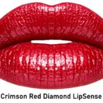 Close-up of glossy crimson red lips, advertising Crimson Red Diamond LipSense.